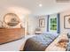 Sunlit main bedroom with a large window and stylish decor at 12136 Devon Square Ct, Charlotte, NC 28262