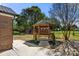 View of backyard featuring a wooden gazebo with lush landscaping at 124 Hunters Creek Dr, Mooresville, NC 28115