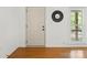 Bright foyer with hardwood floors, a front door, and a white-framed window at 124 Hunters Creek Dr, Mooresville, NC 28115