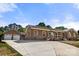 Home exterior shot with a two-car garage and long driveway at 124 Hunters Creek Dr, Mooresville, NC 28115