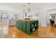 Spacious kitchen with green island, butcher block countertop, stainless appliances, and bright, open layout at 124 Hunters Creek Dr, Mooresville, NC 28115