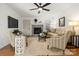 Inviting living room featuring a fireplace, comfortable seating, and bright natural light at 124 Hunters Creek Dr, Mooresville, NC 28115