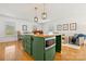 Cozy living space featuring a green island with a butcher block countertop and hardwood flooring at 124 Hunters Creek Dr, Mooresville, NC 28115