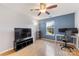 Bedroom area with natural light, desk, ceiling fan, and neutral wall paint at 12628 Waterfall Pl, Charlotte, NC 28278