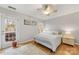 Bright bedroom featuring natural light, wood floors, and neutral decor at 12628 Waterfall Pl, Charlotte, NC 28278