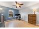 Bedroom area with natural light, desk, ceiling fan, and neutral wall paint at 12628 Waterfall Pl, Charlotte, NC 28278