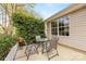 Cozy patio with a table and four chairs, perfect for outdoor dining or relaxing at 12628 Waterfall Pl, Charlotte, NC 28278