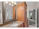 Well-lit bathroom with granite countertops, a large mirror, and modern fixtures at 1305 Anniston Pl, Wesley Chapel, NC 28079