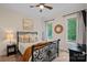 Cozy bedroom featuring natural light, neutral decor and comfortable furnishings at 1305 Anniston Pl, Wesley Chapel, NC 28079