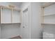 Walk-in closet with custom shelving and ample storage space at 1305 Anniston Pl, Wesley Chapel, NC 28079