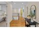 Bright hallway with gleaming hardwood floors, elegant staircase, and tasteful decor at 1305 Anniston Pl, Wesley Chapel, NC 28079