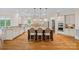 Spacious kitchen features a large island, granite countertops, stainless steel appliances, and ample cabinetry at 1305 Anniston Pl, Wesley Chapel, NC 28079