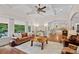 Bright and airy living room featuring hardwood floors and an open floorplan at 1305 Anniston Pl, Wesley Chapel, NC 28079