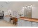 Stylish main bathroom with double vanity, decorative mirrors, granite countertops, and ample counter space at 1305 Anniston Pl, Wesley Chapel, NC 28079