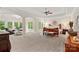 Spacious main bedroom featuring tray ceilings, sitting area, and large windows offering natural light and views at 1305 Anniston Pl, Wesley Chapel, NC 28079