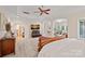 The main bedroom offers ample space, natural light, and arched doorways providing a luxurious and open feel at 1305 Anniston Pl, Wesley Chapel, NC 28079