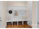 Mudroom with built-in storage, a bench, and stylish decor at 1305 Anniston Pl, Wesley Chapel, NC 28079