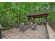 Outdoor patio with fireplace, comfortable seating and heaters for enjoying the outdoors year-round at 1305 Anniston Pl, Wesley Chapel, NC 28079