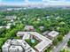 Aerial image of apartment complex with courtyard pool and expansive views of skyline and surrounding green spaces at 1323 Queens Rd # 420, Charlotte, NC 28207