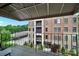 View of the multi story brick building from the balcony at 1323 Queens Rd # 420, Charlotte, NC 28207