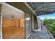 Open sliding glass door leads to a bright living room from the balcony at 1323 Queens Rd # 420, Charlotte, NC 28207