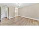 Bright bedroom featuring light wood floors and doorway at 1323 Queens Rd # 420, Charlotte, NC 28207
