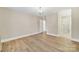 Bright bedroom featuring a modern chandelier and light wood floors at 1323 Queens Rd # 420, Charlotte, NC 28207