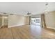 Expansive living room with a ceiling fan and balcony, offering ample space for furniture and decor at 1323 Queens Rd # 420, Charlotte, NC 28207