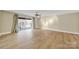 Expansive living room with a balcony, offering ample space for furniture and decor at 1323 Queens Rd # 420, Charlotte, NC 28207