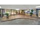 Grand entrance of the condo features seating, tiled floors, and glass doors at 1323 Queens Rd # 420, Charlotte, NC 28207