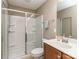 Bathroom featuring glass shower doors, toilet, vanity and a large mirror above the sink at 140 Halifax Dr, Fort Mill, SC 29707