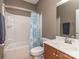 Bathroom featuring shower and tub, vanity with sink, and blue and white shower curtain at 140 Halifax Dr, Fort Mill, SC 29707