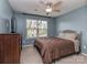 Cozy bedroom with a ceiling fan, a double bed, a large dresser and a window with neighborhood view at 140 Halifax Dr, Fort Mill, SC 29707