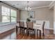 Cozy dining room with a large window, chandelier, and elegant table setting at 140 Halifax Dr, Fort Mill, SC 29707