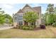 Beautiful home featuring a well-maintained lawn, mature tree, and brick accents at 140 Halifax Dr, Fort Mill, SC 29707