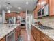 Gourmet kitchen boasts granite countertops, stainless steel appliances, and a gas cooktop at 140 Halifax Dr, Fort Mill, SC 29707
