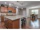 Open kitchen design with granite island, stainless appliances, and adjacent dining area at 140 Halifax Dr, Fort Mill, SC 29707