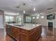 Large kitchen island features granite countertops, ample storage, and stylish pendant lighting at 140 Halifax Dr, Fort Mill, SC 29707