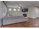 Cozy living room with a fireplace, hardwood floors, and a comfortable couch at 140 Halifax Dr, Fort Mill, SC 29707