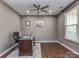 Comfortable office space with a desk, hardwood floors, and a ceiling fan at 140 Halifax Dr, Fort Mill, SC 29707