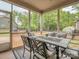 Relax on the screened-in porch with a dining table and comfortable seating, perfect for enjoying the outdoors at 140 Halifax Dr, Fort Mill, SC 29707