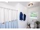 Clean bathroom with a shower and blue towels, featuring a neutral color palette at 1488 Ernest Rd, York, SC 29745