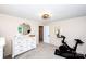 Functional bedroom with a Peloton bike, dresser, and carpeted floor at 1488 Ernest Rd, York, SC 29745