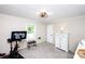 Practical bedroom features a Peloton bike, windows, and furniture at 1488 Ernest Rd, York, SC 29745