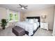Inviting bedroom featuring a large bed with a patterned comforter, matching nightstands, and plenty of natural light at 1488 Ernest Rd, York, SC 29745