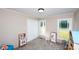A bright bedroom displays ample natural light, soft carpet and a closet; perfect for relaxation at 1488 Ernest Rd, York, SC 29745