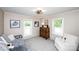 Comfortable bedroom is styled with a daybed, accent chair and carpeted floors at 1488 Ernest Rd, York, SC 29745