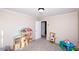 The bedroom boasts plenty of space for play with a closet, neutral carpet and walls at 1488 Ernest Rd, York, SC 29745
