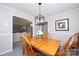 Inviting dining room with wood table, chairs, overhead lighting and neutral wall color at 1488 Ernest Rd, York, SC 29745