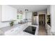 Bright kitchen with stainless steel refrigerator, granite countertops and an island cooktop at 1488 Ernest Rd, York, SC 29745